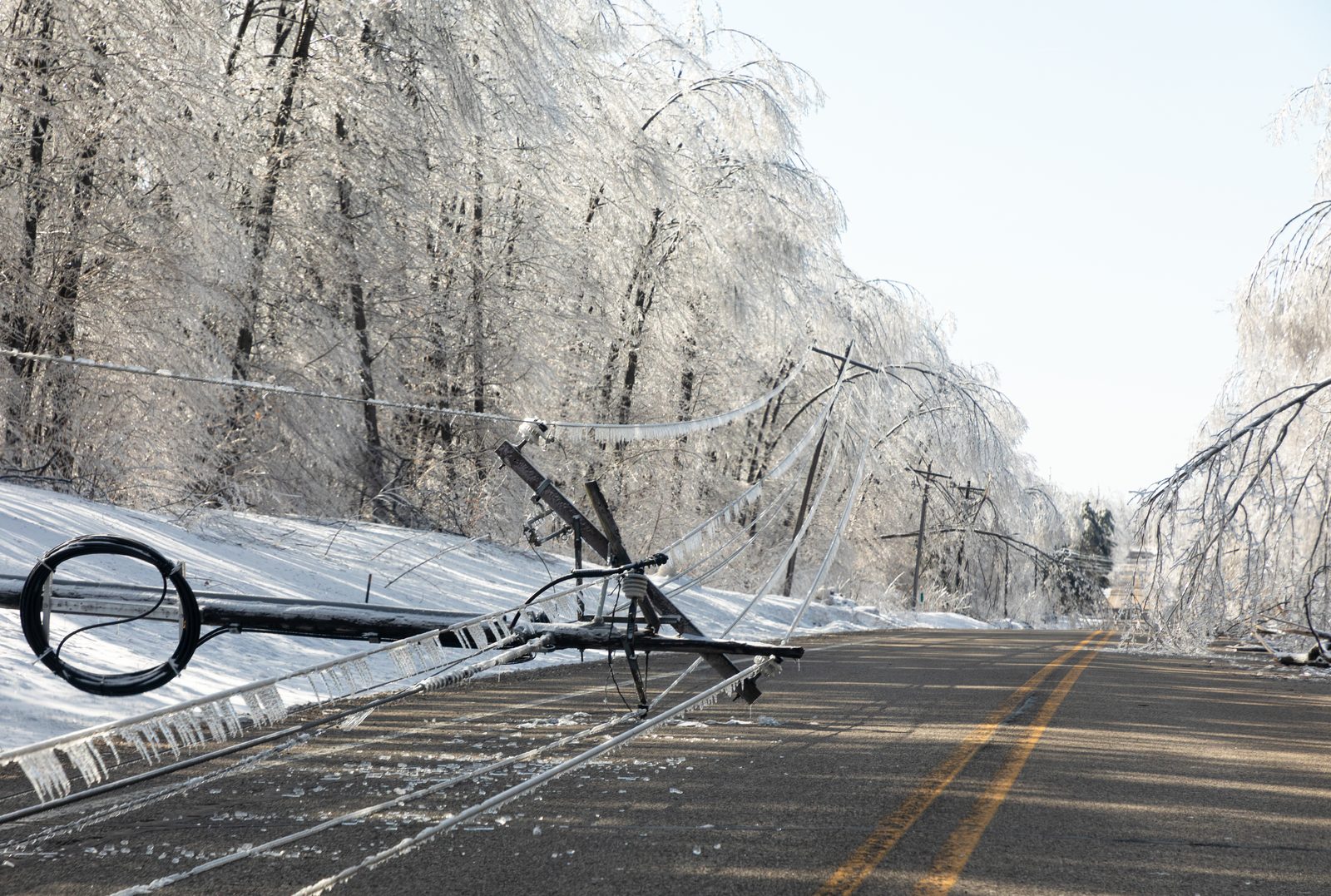 A Maine ice storm that brought power lines and tree limbs down across the road